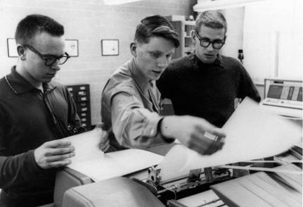 Bob Zarnke (centre) and two other students retrieve a computer printout